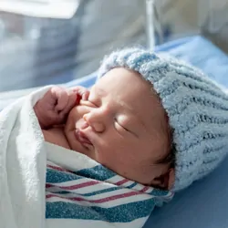 Newborn baby girl and mother in the hospital