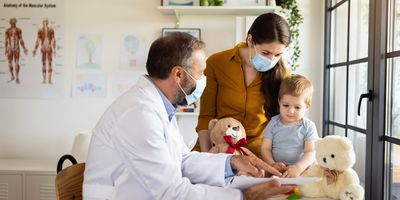 Caucasian mother and baby son at a doctor´s appointment