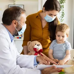 Caucasian mother and baby son at a doctor´s appointment