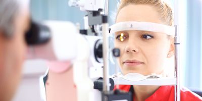 Closeup of late 20's blond woman visiting optician