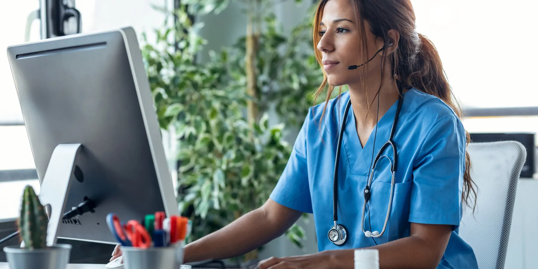 Shot of female doctor talking with earphone while explaining medical treatment to patient through a video call 