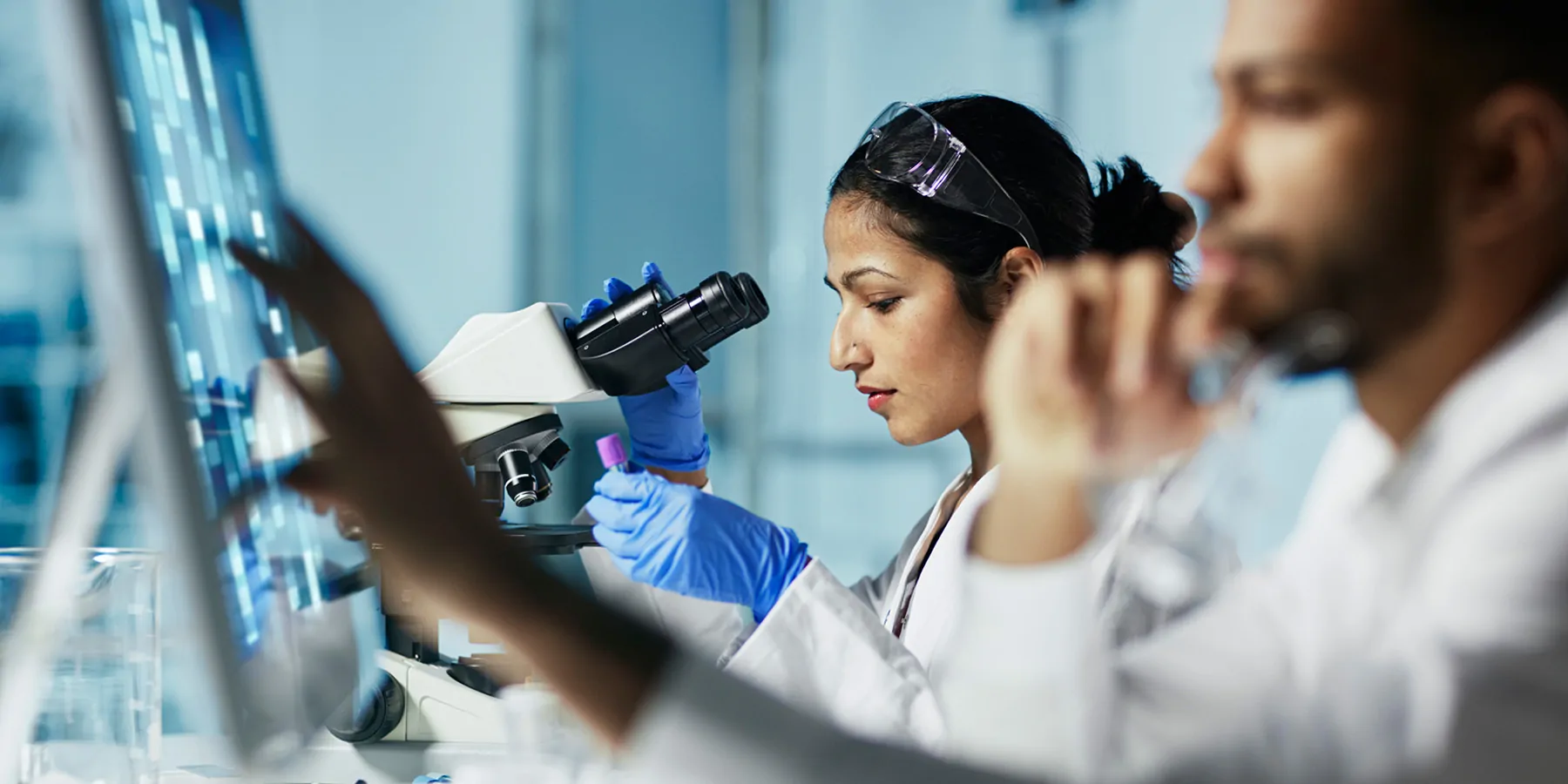 Scientist Working on Computer In Modern Laboratory
