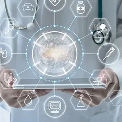 Doctor holding a tablet with holographic interface above