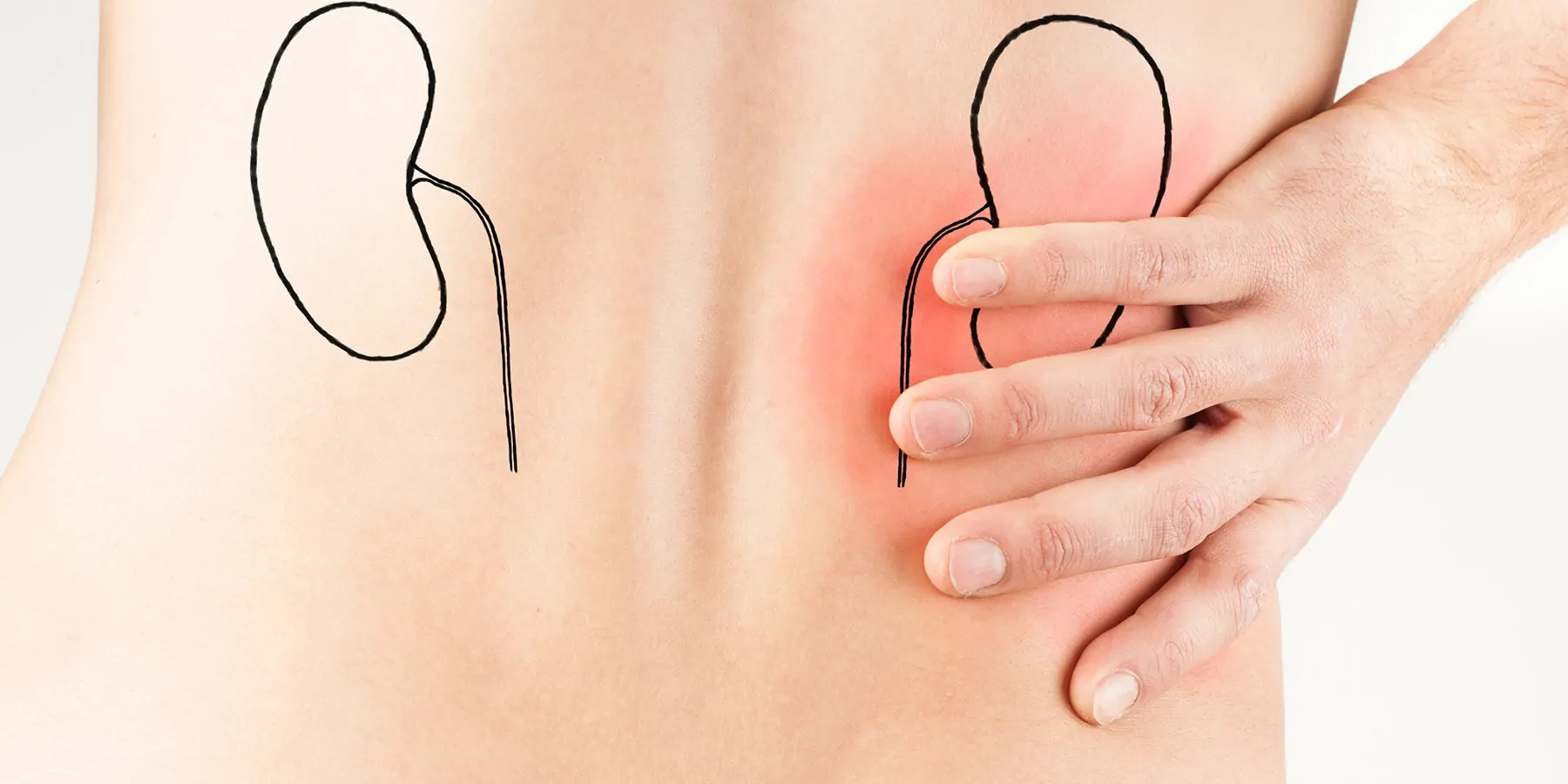 Young male adult holding his back because of pain