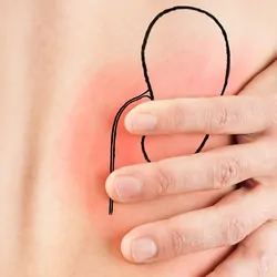 Young male adult holding his back because of pain