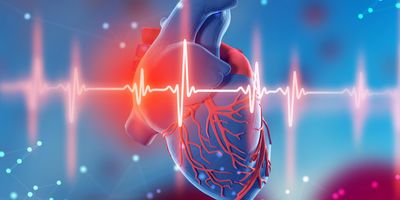 computer generated image of a human heart and cardiogram on a blue background