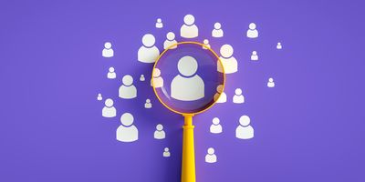 A representation of recruitment and retention showing a magnifying glass focusing on the person who is the right fit among others who may not be the best fit for a given team.