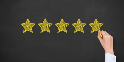 A representation of laboratory quality showing five stars drawn on the blackboard.
