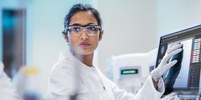 Laboratory professional analyzing cancer NGS results