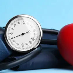 Blood pressure monitor on a blue background