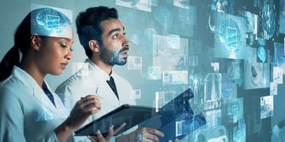 Two clinicians looking at holographic data