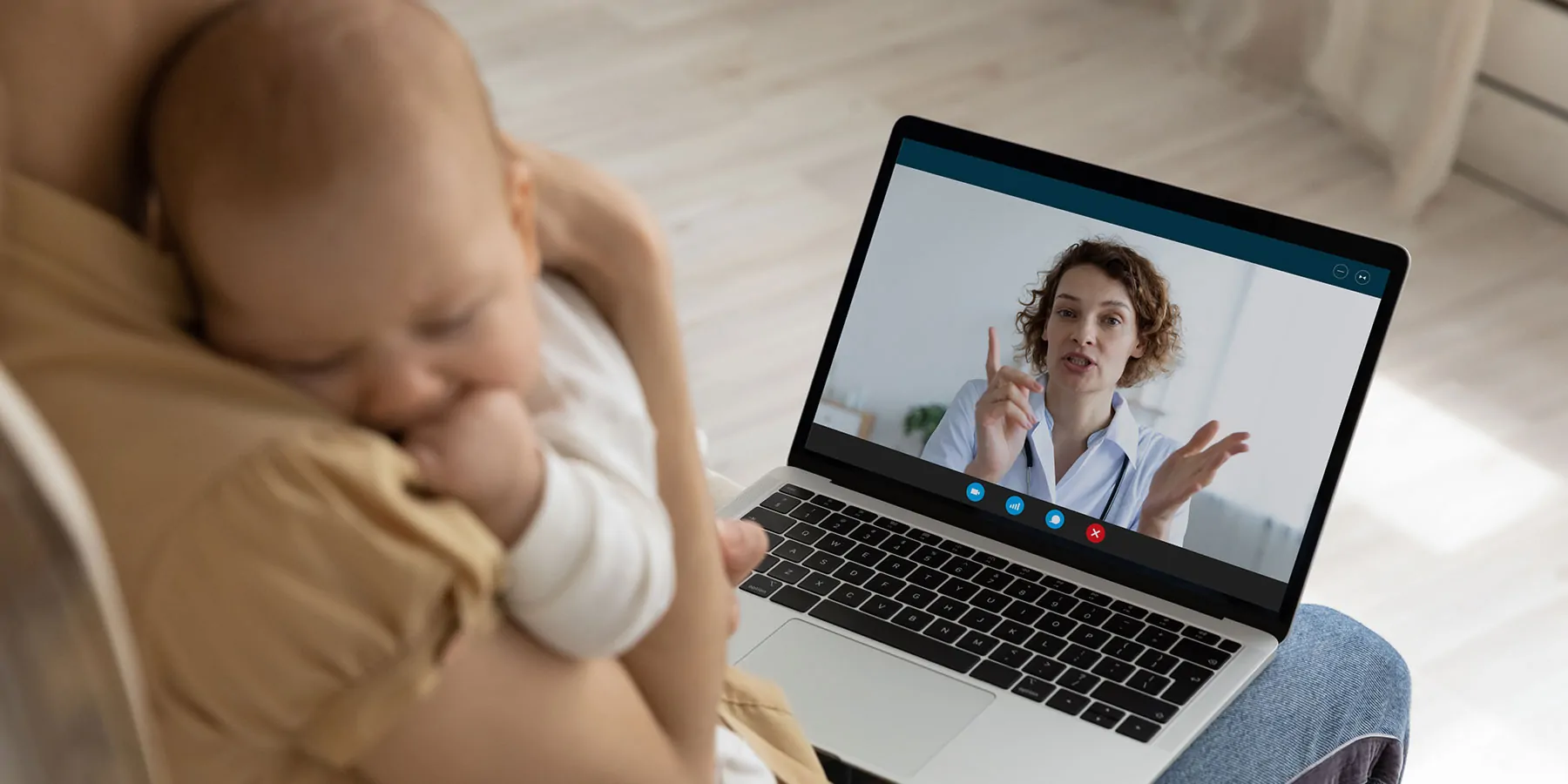 Women with baby getting telehealth check up