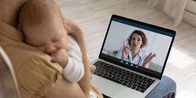 Women with baby getting telehealth check up