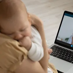 Women with baby getting telehealth check up