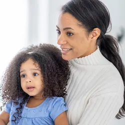 Young mom with toddler getting medical check up