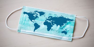 A world map printed on a surgical mask