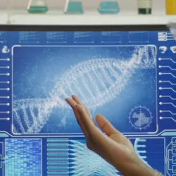 Two researchers looking at DNA on a computer screen