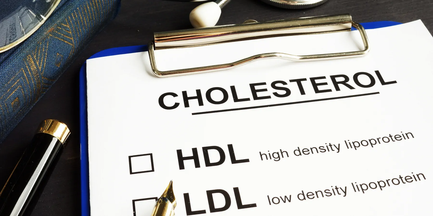 Clipboard with cholesterol diagnostics on it