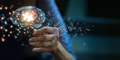 Elderly woman holding holographic brain image