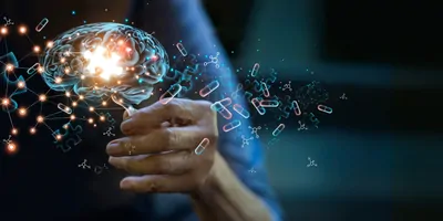 Elderly woman holding holographic brain image