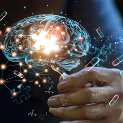 Elderly woman holding holographic brain image