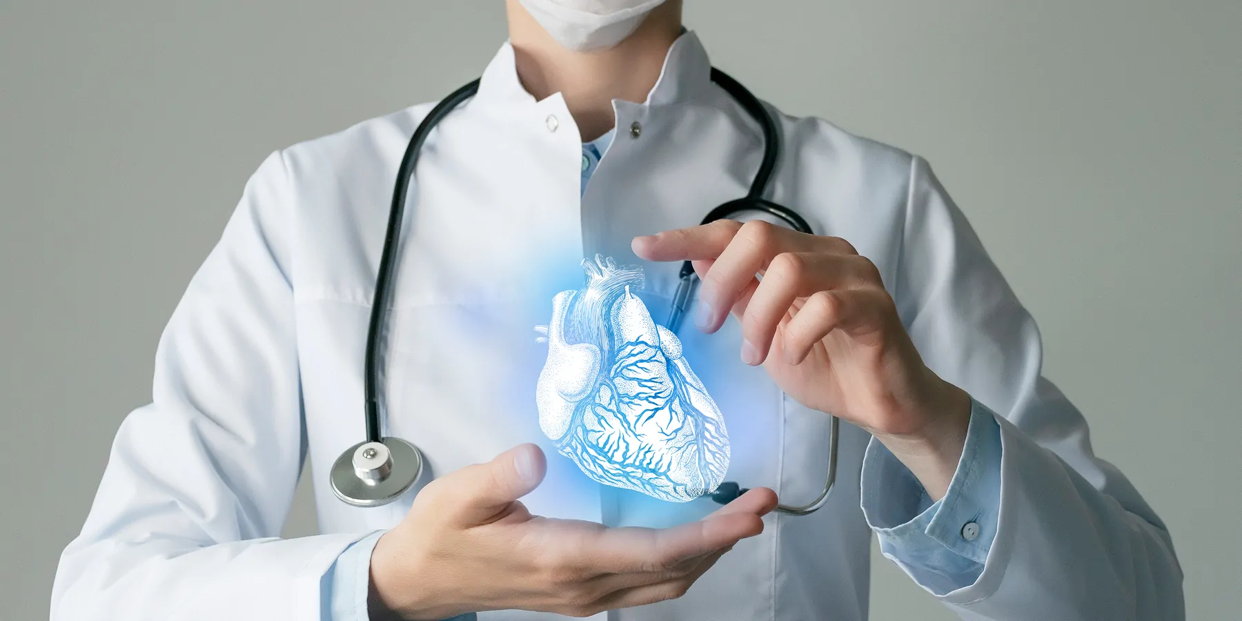 Most Heart Transplant Centers’ Websites Get Failing Grade for Clarity Doctor holding a holographic image of a human heart