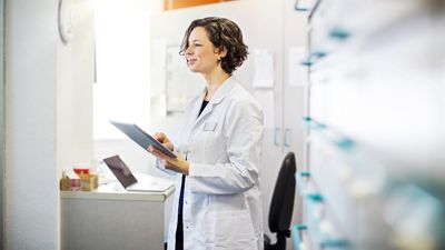 Scientist looking at chart