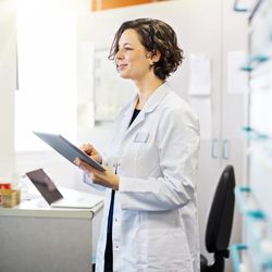 Scientist looking at chart