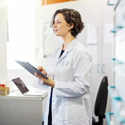 Scientist looking at chart