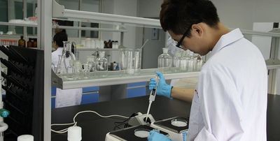 Molecular biology scientist using pipette