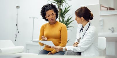 Female patient and doctor discussing a clinical trial