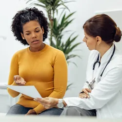 Female patient and doctor discussing a clinical trial