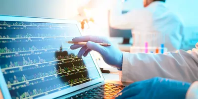 Researcher looking at genotypes on a computer screen
