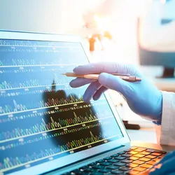 Researcher looking at genotypes on a computer screen