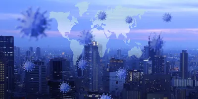 Double exposure of a city and a map of the world with viral particles around