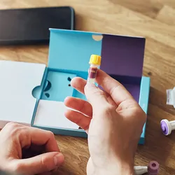 Photo of a clinical trial participant taking a self-collection blood sample.