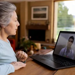 Older patient receiving health care via telemedicine