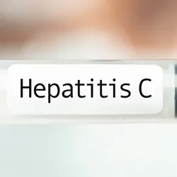 Medical professional holding a syring with Hepatitis C written on it