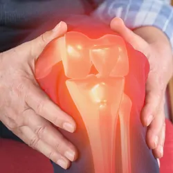 Man with knee pain, computer image of knee join is visible