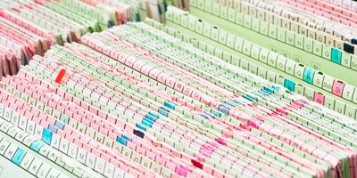 Close up of a stack of patients' medical records.
