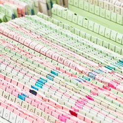 Close up of a stack of patients' medical records.