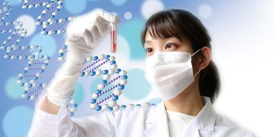 A female researcher wearing PPE looks at a test tube with blood held in her right hand and is against a background of DNA double helix graphic.