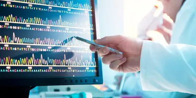 A scientist looking at a DNA sequence 