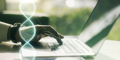 Laptop open with DNA strand