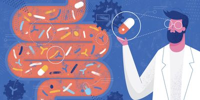 Technician with pill capsule in front of intestine 