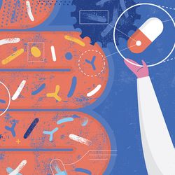 Technician with pill capsule in front of intestine 