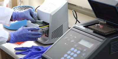 Laboratory technician preparing samples for PCR amplification