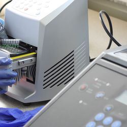 Laboratory technician preparing samples for PCR amplification