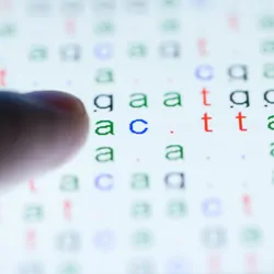 Color-coded DNA sequence on touch pad illuminated by light