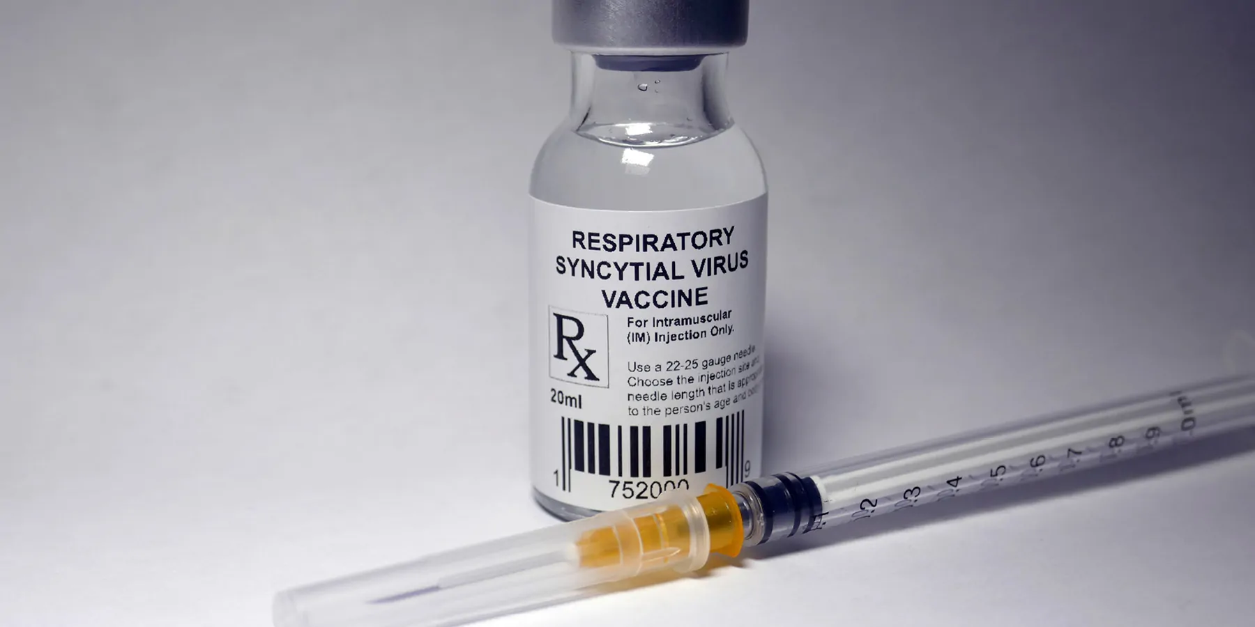 Respiratory syncytial virus vaccine vial and an unused syringe